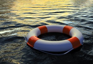bigstock-Buoy-Ring-floating-on-water--16974902
